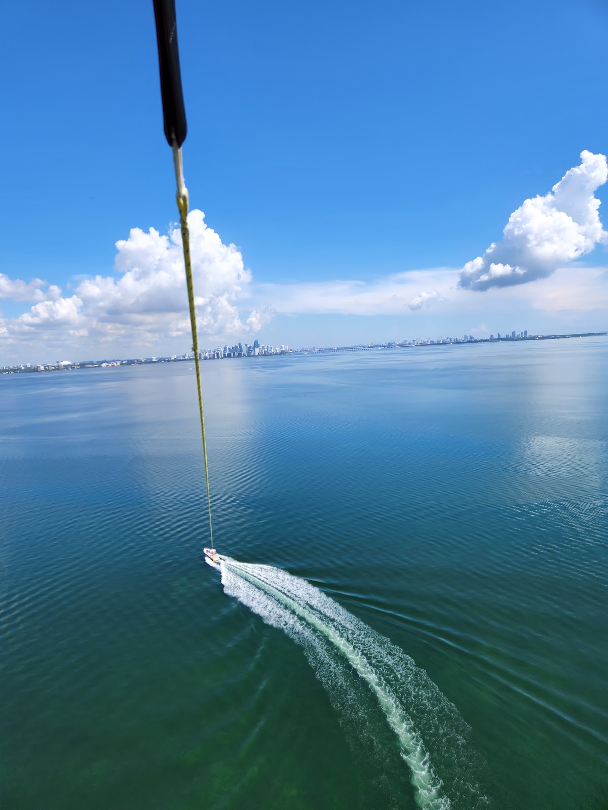 Parasailer above Biscayne Bay with the Miami skyline behind