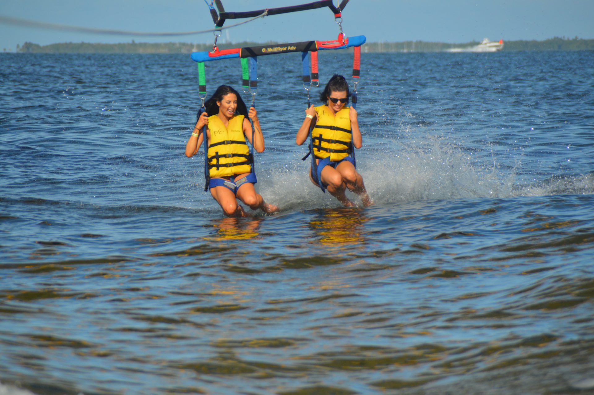 Friends landing parasail in the water